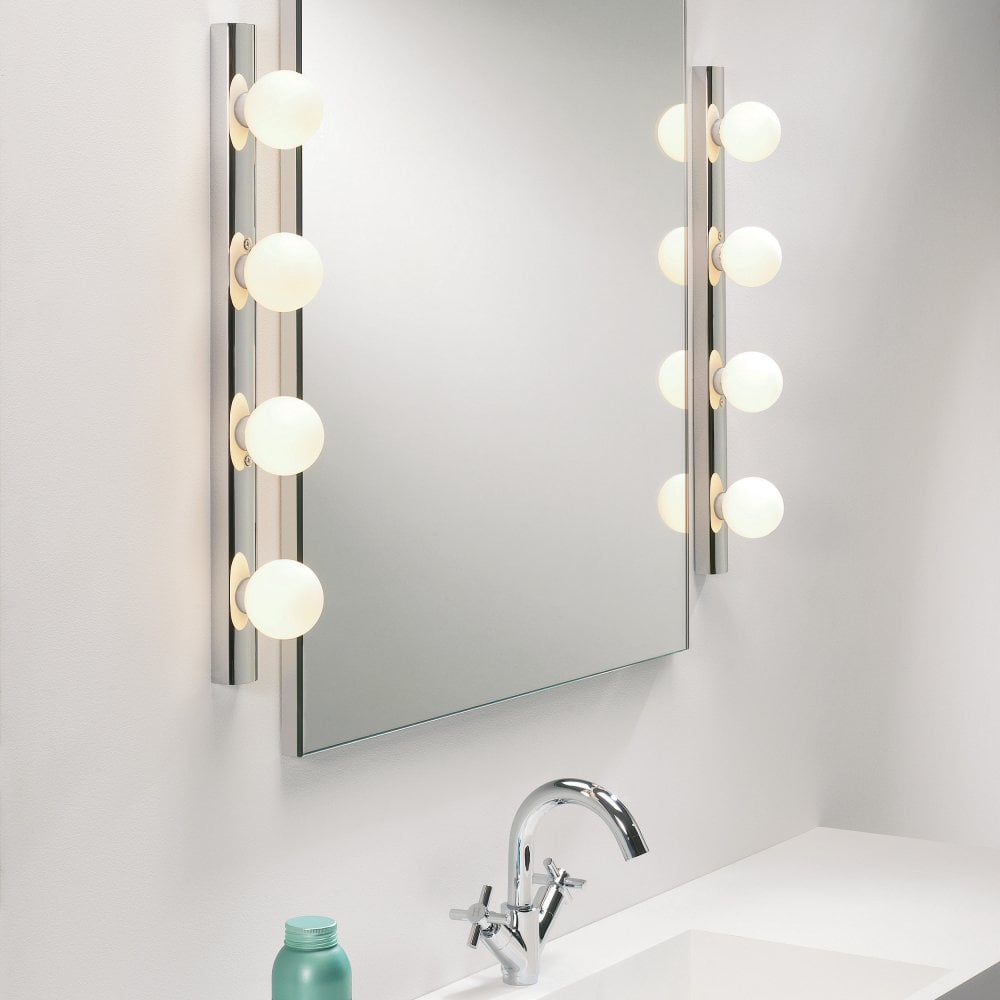 Bathroom wall light with globe shades.