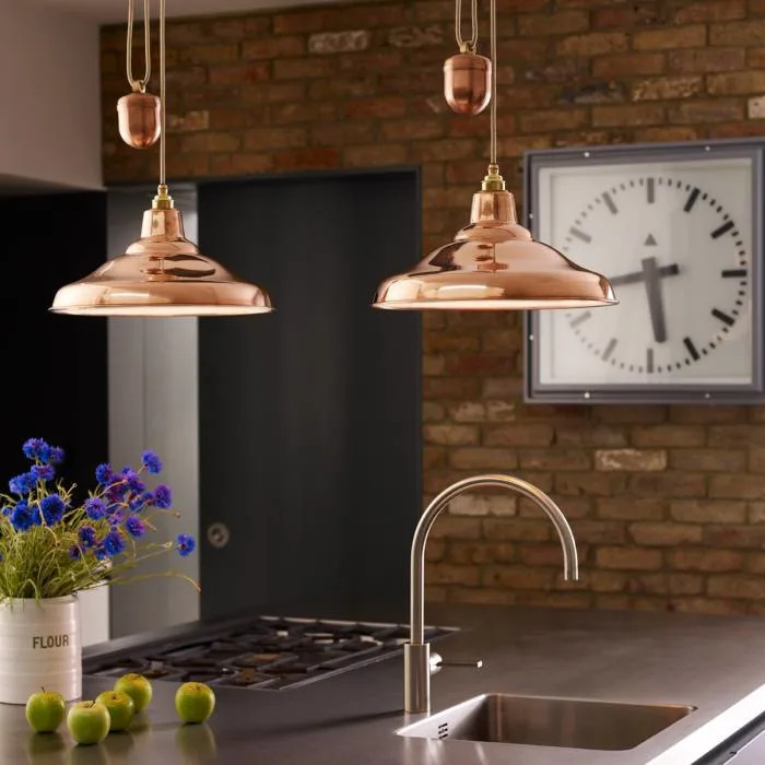 brass rise and fall over kitchen sink