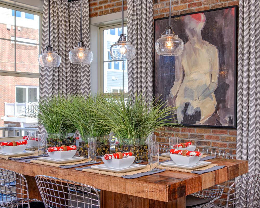 restaurant table with four nickel seeded glass hanging pendants.