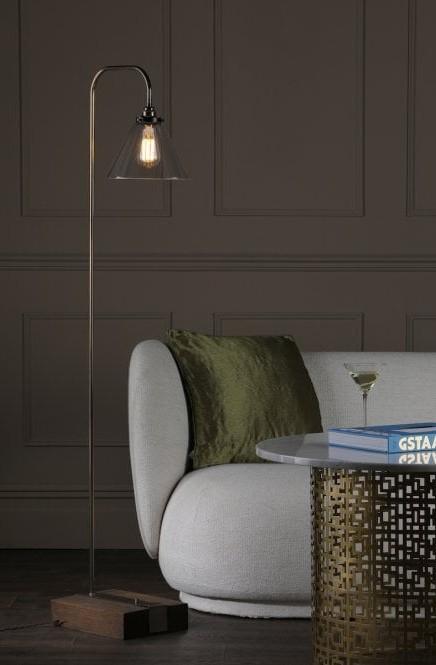 floor lamp next to a sofa and coffee table