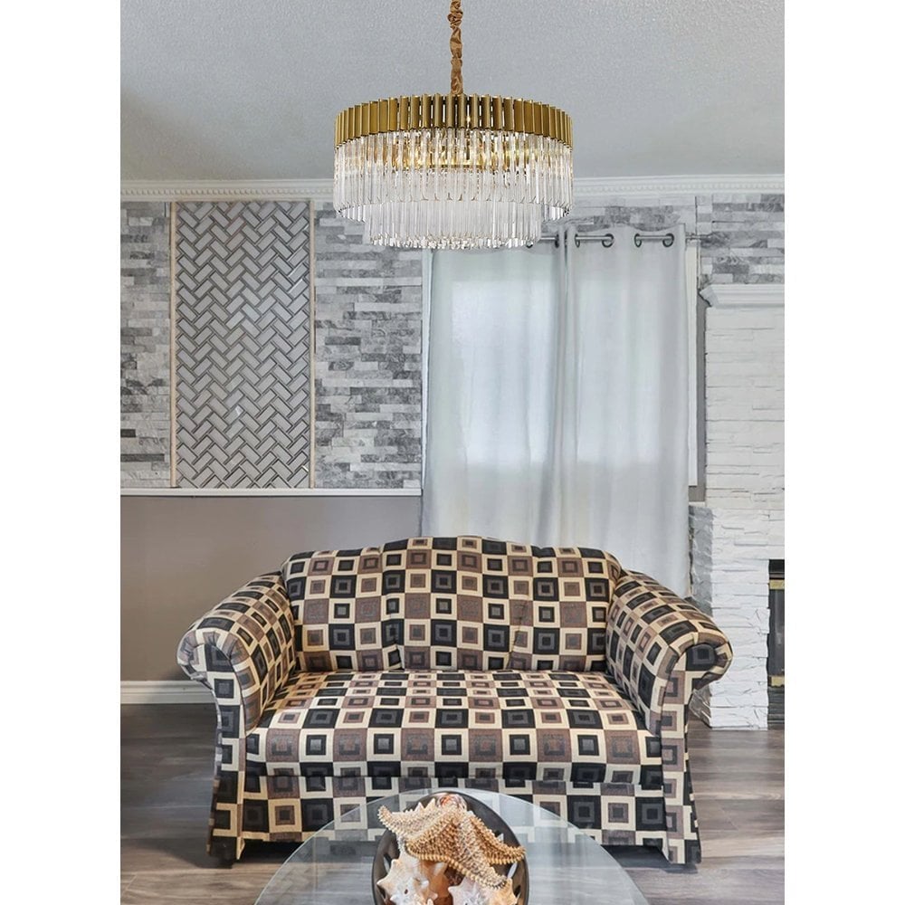 gold and crystal chandelier above sofa