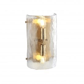 modern wall sconce in brushed brass finish with clear textured glass curved shade 