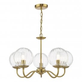 a modern five arm chandelier with glass globe shades