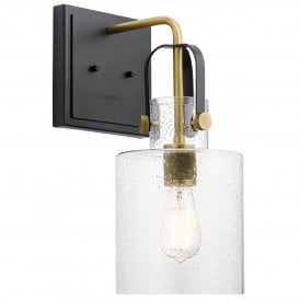 black and brass wall light with seeded glass