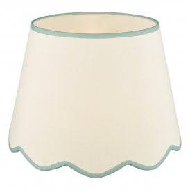 A large, neutral scallop shade lamp shade with blue edge detail