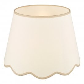 A large, neutral scallop shade lamp shade with taupe edge detail