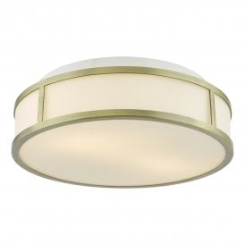 An art deco inspired flush bathroom ceiling light with aged brass frame and opal glass shade