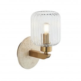 travertine stone wall sconce with ribbed glass shade and brass accents