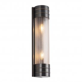 modern linear wall sconce in an urban bronze finish with prismatic textured glass shade