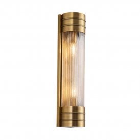 modern linear wall sconce in a vintage brass and prismatic glass finish