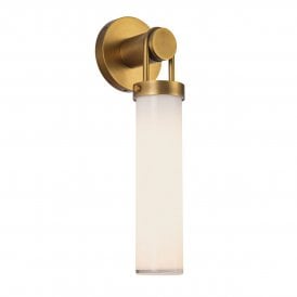 a modern sconce finished in antique brass with opal glass shade
